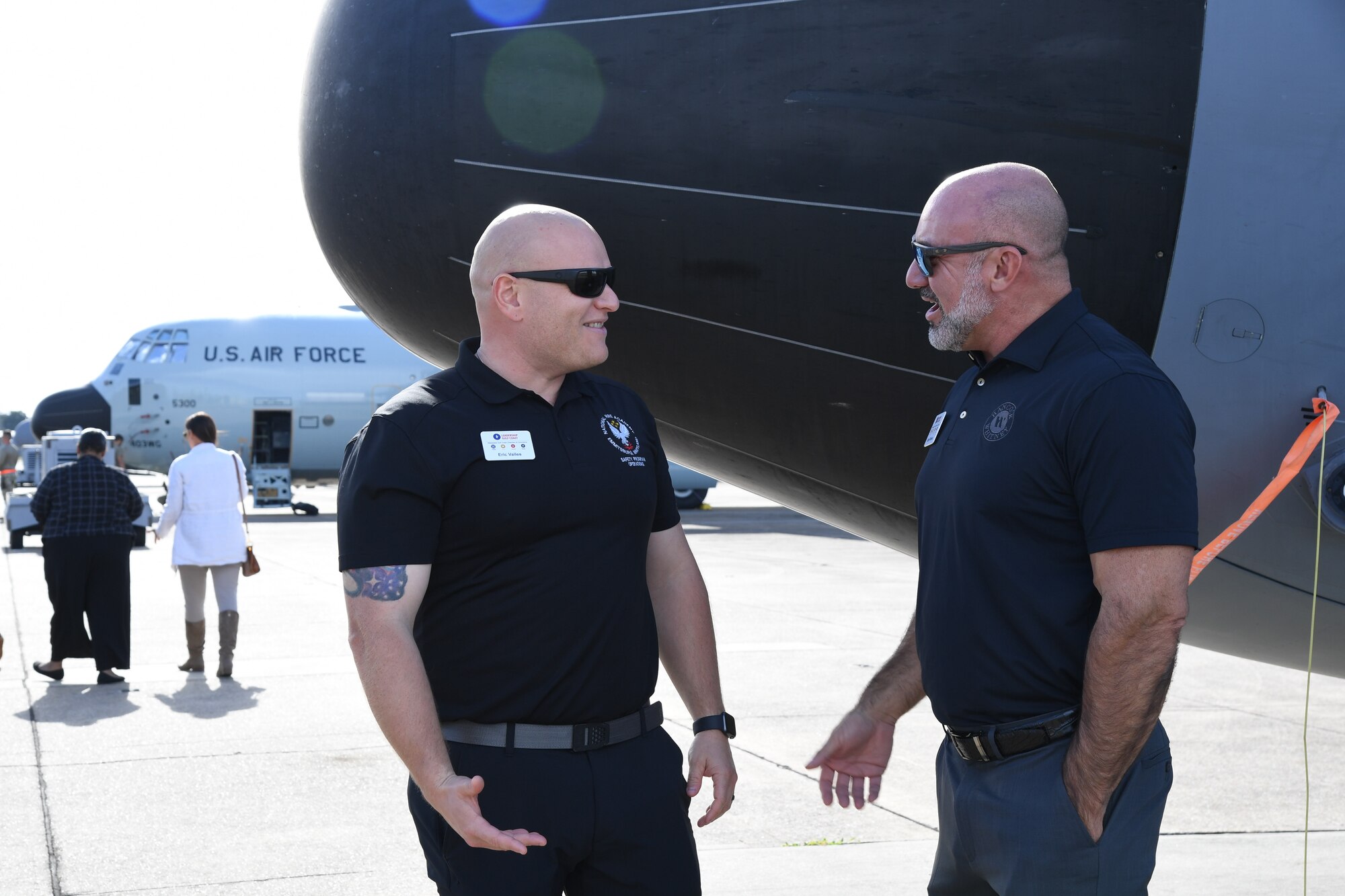 Eric Valles, Gulfport Fire Department chief of training, and Benji James Richoux, Hancock Whitney Bank business banking senior vice president, engage in conversation during a Mississippi Gulf Coast Chamber of Commerce Leadership Gulf Coast tour at Keesler Air Force Base, Mississippi, Nov. 9, 2022.