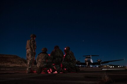 Members of the 137th Mission Sustainment Team look over a map as they conduct a site survey during ATREUS 22-4 at Andøya Space Defense Range, Norway, Nov. 8, 2022. This was the first time the multi-capable Airmen conducted their mission in a setting realistic to the austere environments they will encounter while supporting global SOF operations. (U.S. Air National Guard photo by Tech. Sgt. Brigette Waltermire)