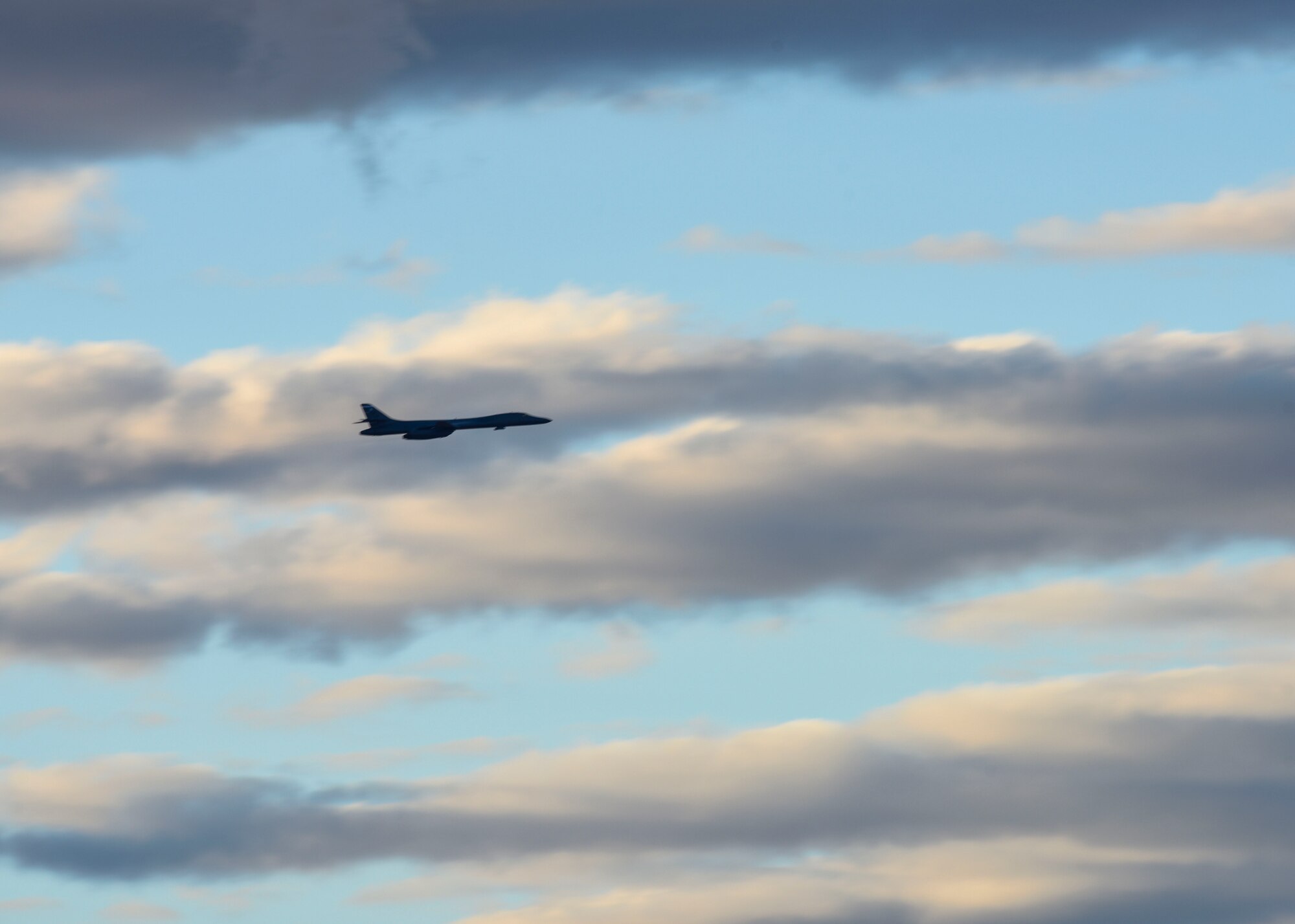 A U.S. Air Force B-1B Lancer aircraft assigned to the 7th Bomb Wing at Dyess Air Force Base soars through the clouds Nov. 4, 2022, during an integration training at Luke Air Force Base, Arizona.