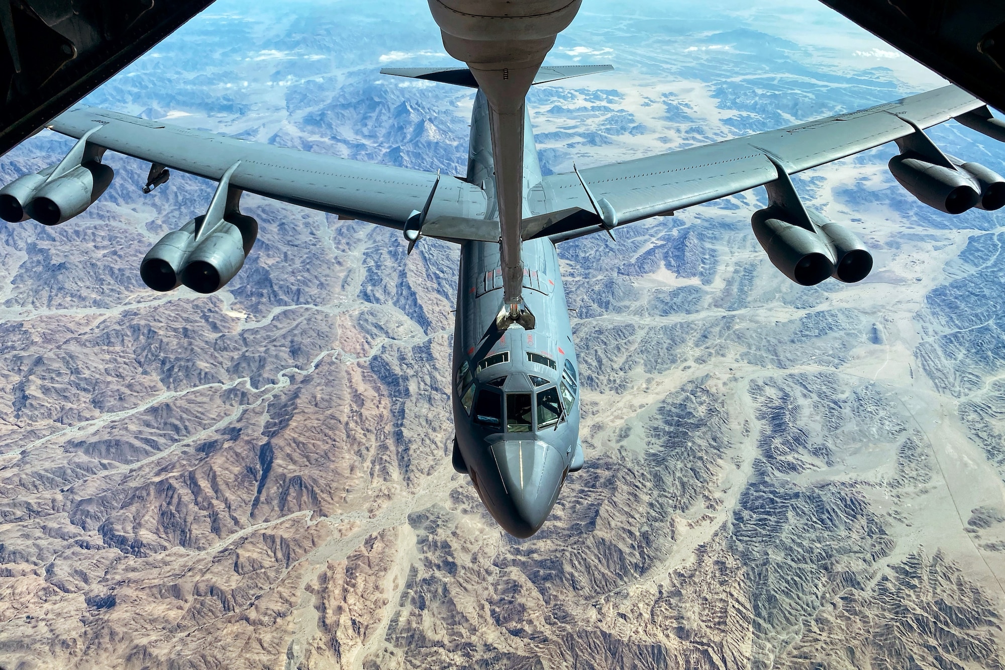 A U.S. Air Force B-52H Stratofortress from Barksdale Air Force Base, La., is refueled by a U.S. Air Force KC-10 Extender assigned to the 908th Expeditionary Air Refueling Squadron, during a Bomber Task Force mission over the U.S. Central Command area of responsibility, Nov. 10, 2022. The bomber deployment showcases the U.S. military’s commitment to regional security and demonstrates the capabilities of a short-notice, rapid deployment of assets. The B-52 is a long-range, heavy bomber, capable of flying high subsonic speeds at altitudes up to 50,000 feet providing the U.S., coalition and partner forces with a global strike capability to deter conflict while credibly demonstrating the U.S.’s ability to address a global security environment. (U.S. Air Force photo by Staff Sgt. Gerald R. Willis)