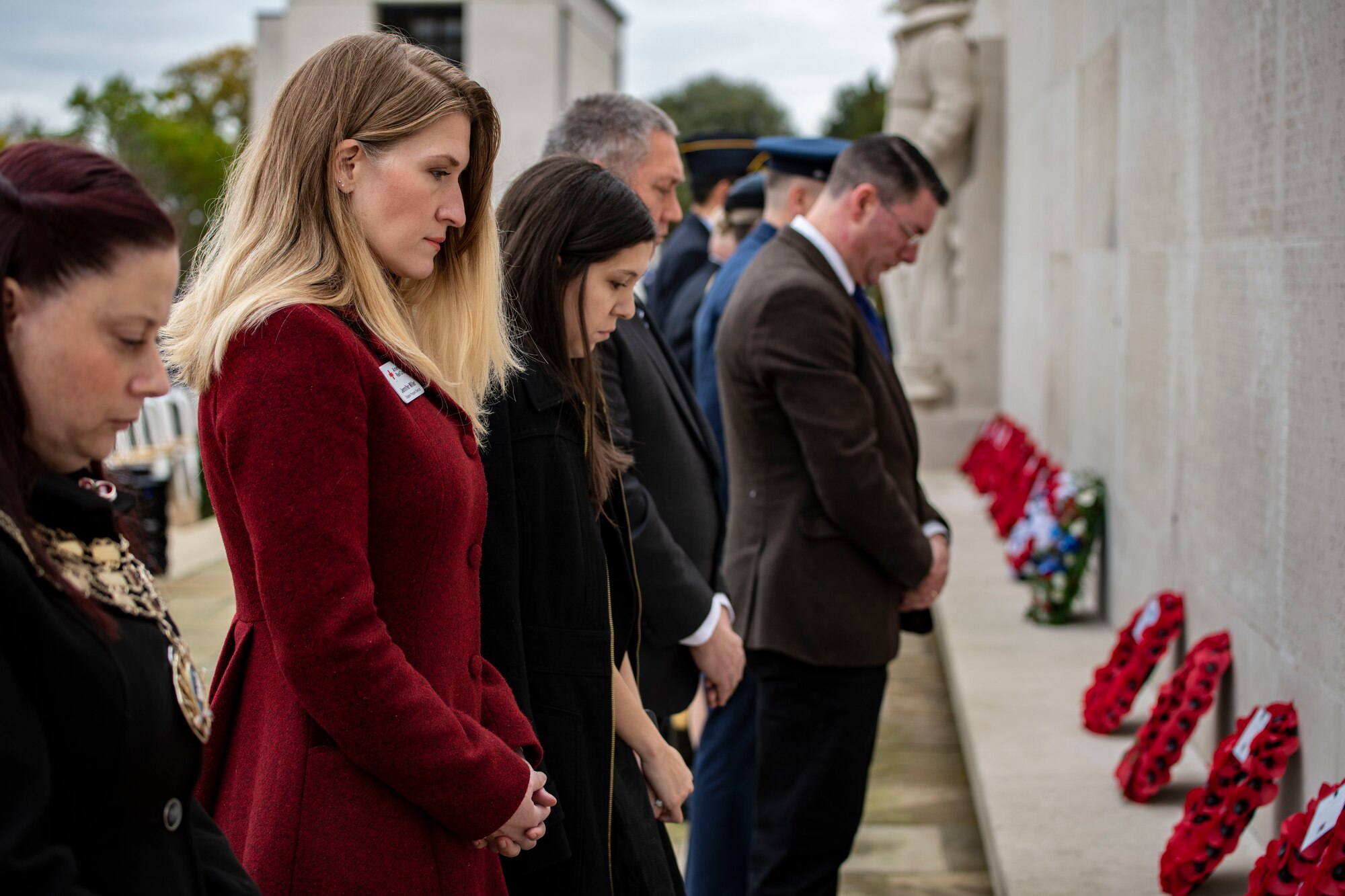 Audience members pay respects during the laying of wreaths at Cambridge American Cemetery and Memorial in Cambridge
