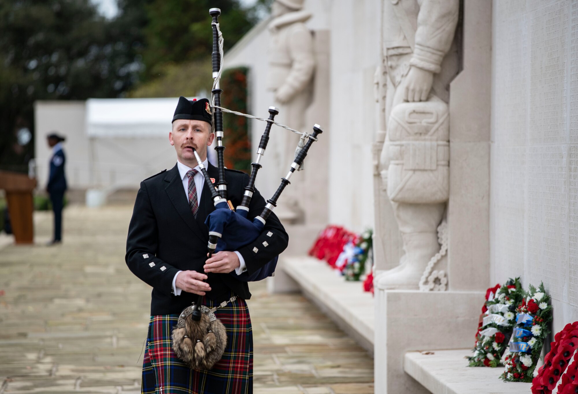 Iain Hildreth, 423d Civil Engineer Squadron lead firefighter, plays the lament “Flowers of the Forest” at Cambridge American Cemetery and Memorial in Cambridge