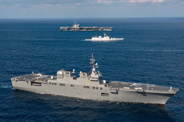 Japan Maritime Self-Defense Force (JMSDF) helicopter destroyer JS Hyuga (DDH 181) steams in formation with the Indian Navy ship INS Shivalik (F 47) and the U.S. Navy’s only forward-deployed aircraft carrier, USS Ronald Reagan (CVN 76), during Exercise Malabar 2022, in the Philippine Sea, Nov. 11.