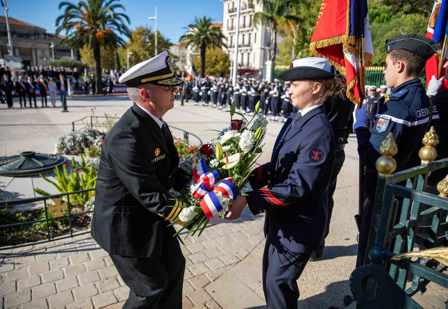 TOULON, France (Nov. 11, 2022) Vice Adm. Thomas Ishee, commander, U.S. Sixth Fleet, accepts a wreath from a member of the French navy to lay in front of a memorial, during a wreath laying ceremony in commemoration of Armistice Day at the war memorial in Toulon, France, Nov. 11, 2022. Roosevelt is on a scheduled deployment in the U.S. Naval Forces Europe area of operations, employed by U.S. Sixth Fleet to defend U.S., allied and partner interests. (U.S. Navy photo by Mass Communication Specialist 2nd Class Danielle Baker/Released)