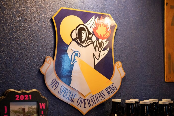 Wall decorations featuring 919th SOW wing shield