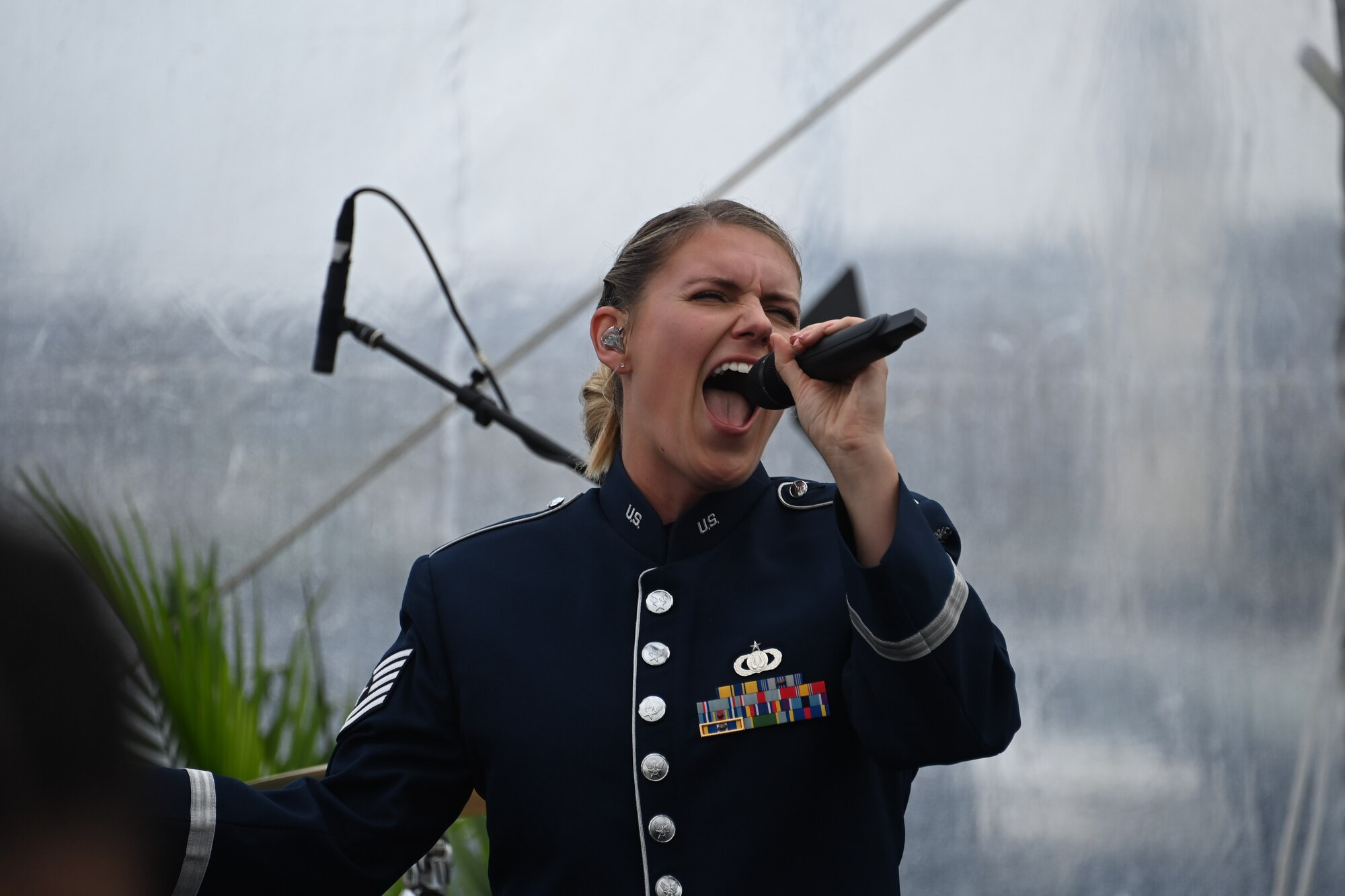 Tech. Sgt. Nadia Sosnoski, U.S. Air Force Band Singing Sergeants soprano, sings at the opening of Spirit Park in National Harbor, Md., Nov. 11, 2022. After the raising of the flag, the event continued with the playing of the Air Force Band’s original song “This Flag” where the crowd shared a moment of musical harmony. (U.S. Air Force photo by Staff Sgt. Spencer Slocum)