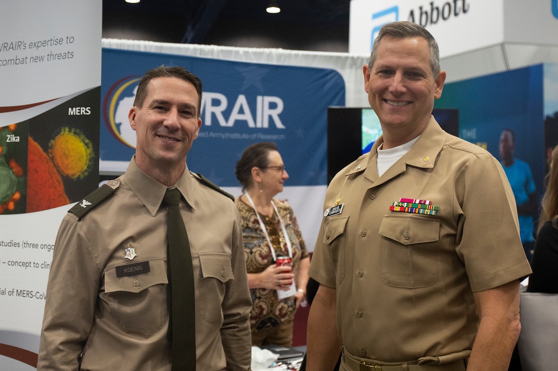 Col. Chad Koenig, Walter Reed Army Institute of Research, commander and Capt. William Deniston, Naval Medical Research Center, commander attended the American Society of Tropical Medicine and Hygiene 71st Annual Meeting, held Oct. 30 - Nov. 3.  (U.S. Army Photo by Lee Osberry/released)