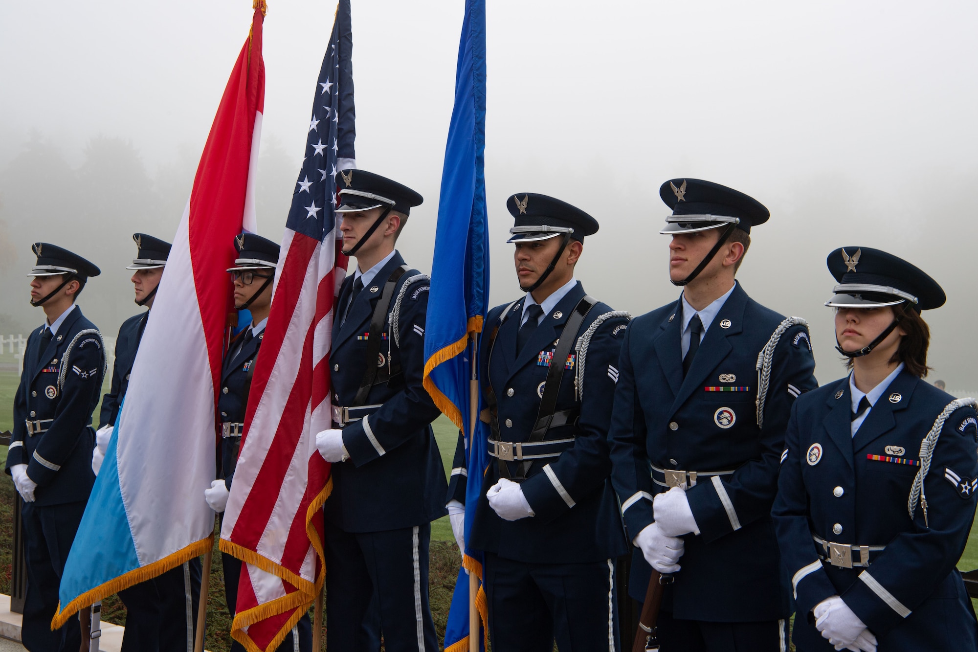 Honor Guard members from Spangdahlem Air Base perform a flag detail at a Veterans Day ceremony