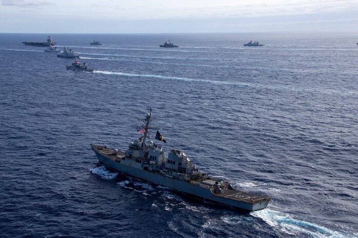 The first-in-class aircraft carrier USS Gerald R. Ford (CVN 78) steams in the Atlantic Ocean in formation with the German frigate FGS Hessen (F 221), Ticonderoga-class guided-missile cruiser USS Normandy (CG 60), Danish frigate HDMS Peter Willemoes (FFH 362), Spanish Armada frigate Álvaro de Bazán (F 101), Dutch frigate HNLMS De Zeven Provincien (F 802), French frigate FS Chevalier Paul (D 621), Dutch frigate HNLMS van Amstel (F 831) and Arleigh Burke-class guided-missile destroyer USS McFaul (DDG 74), Nov. 7, 2022. Exercise Silent Wolverine is a U.S.-led, combined training exercise that tests Ford-class aircraft carrier capabilities through integrated high-end naval warfare scenarios alongside participating allies in the Eastern Atlantic Ocean. The Gerald R. Ford Carrier Strike Group is conducting their first deployment in the U.S. Naval Forces Europe area of operations. (U.S. Navy photo by Mass Communication Specialist 3rd Class Jacob Mattingly)