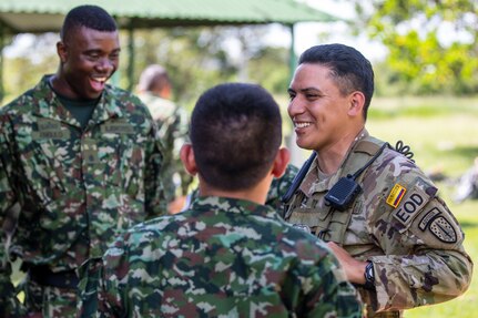 U.S. Army Staff Sgt. Jose Hernandez, an explosive hazards advisor, with the Fort Benning-based, Bravo Company, 1st Battalion, 54th Security Force Assistance Brigade, 648th Maneuver Enhancement Brigade, Georgia Army National Guard, engages with Colombian Army soldiers during prior to training lanes at Exercise Southern Vanguard 23 at Tolemaida Military Base, Colombia, Nov. 12, 2022.