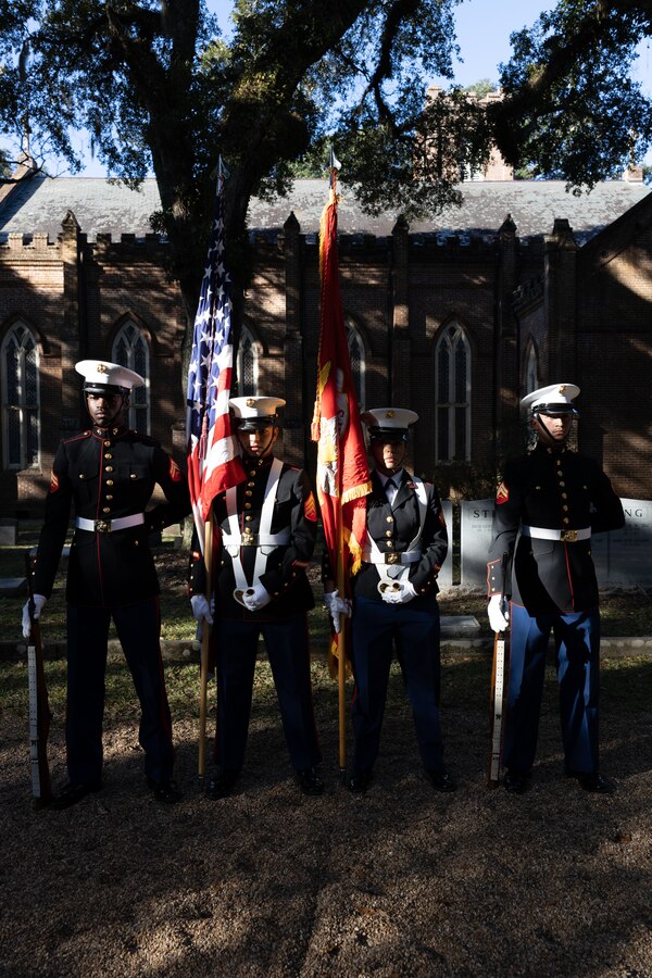 The color guard of Truck Company, 23rd Marine Regiment, 4th Marine Division, stand at parade rest during a wreath laying ceremony at Grace Church of West Feliciana, St. Francisville, La. on Nov. 10, 2022. The ceremony is an annual event that takes place on the Marine Corps birthday at Gen. Robert H. Barrow's gravesite, who served as the 27th Commandant of the Marine Corps. (U.S. Marine Corps photo by Staff Sgt. Jestin Costa)