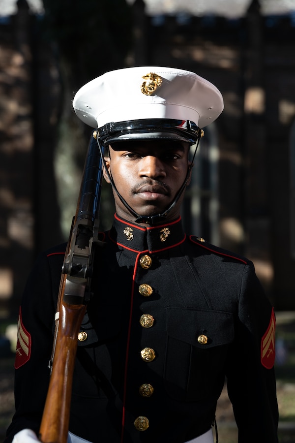 U.S. Marine Corps Cpl. Jahmon Hardwick, a Marine with the Marines Forces Reserve color guard, prepares to present the national colors to the National Anthem during a wreath laying ceremony on Nov. 10, 2022 at Grace Episcopal Church in Saint Francisville, Louisiana. Cpl. Hardwick graduated from Sandalwood Senior High School in Jacksonville, Fl and enlisted in the Marine Corps for better opportunities in his future. The ceremony is an annual event that takes place on the Marine Corps birthday at Gen. Robert H. Barrow's gravesite, who served as the 27th Commandant of the Marine Corps. (U.S. Marine Corps photo by Staff Sgt. Jestin Costa)