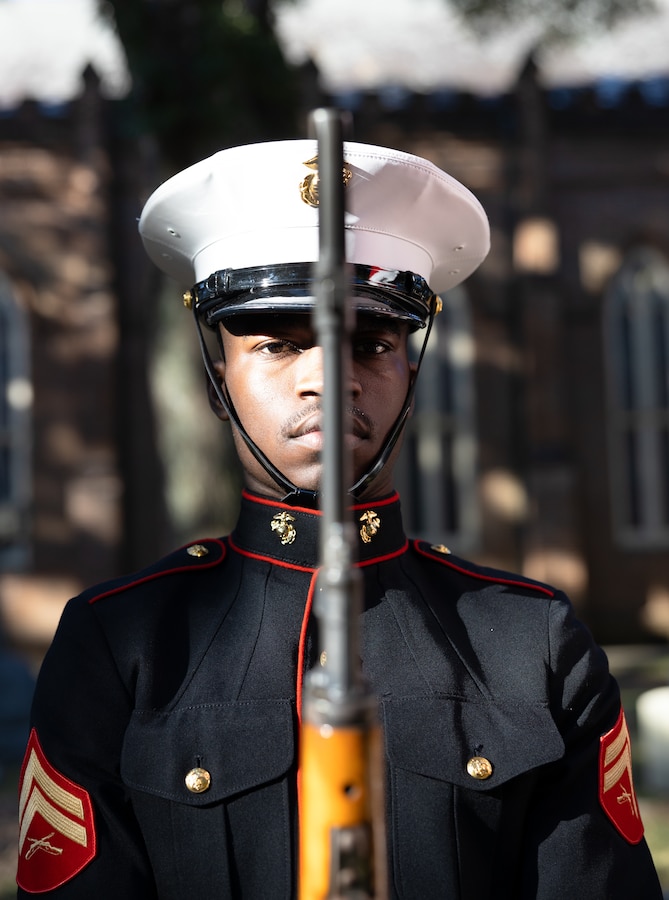 U.S. Marine Corps Cpl. Jahmon Hardwick, a Marine with the Marines Forces Reserve color guard, prepares to present the national colors to the National Anthem during a wreath laying ceremony on Nov. 10, 2022 at Grace Episcopal Church in Saint Francisville, Louisiana. Cpl. Hardwick graduated from Sandalwood Senior High School in Jacksonville, FL and enlisted in the Marine Corps for better opportunities in his future. The ceremony is an annual event that takes place on the Marine Corps birthday at Gen. Robert H. Barrow's gravesite, who served as the 27th Commandant of the Marine Corps. (U.S. Marine Corps photo by Staff Sgt. Jestin Costa)