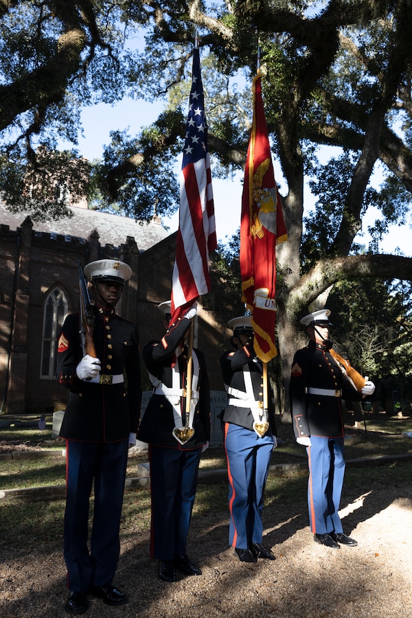 The color guard of Truck Company, 23rd Marine Regiment, 4th Marine Division, stand at parade rest during a wreath laying ceremony at Grace Church of West Feliciana, St. Francisville, La. on Nov. 10, 2022. The ceremony is an annual event that takes place on the Marine Corps birthday at Gen. Robert H. Barrow's gravesite, who served as the 27th Commandant of the Marine Corps. (U.S. Marine Corps photo by Staff Sgt. Jestin Costa)