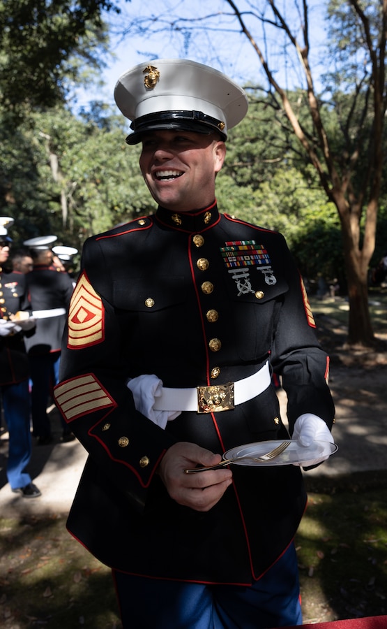 1st Sgt. Steven Norman, sight support 1st Sgt. with Truck Company, 23rd Marine Regiment, 4th Marine Division, passes out cake during a cake cutting and wreath laying ceremony on Nov. 10, 2022 at Grace Episcopal Church in Saint Francisville, Louisiana. The ceremony is an annual event that takes place on the Marine Corps birthday at Gen. Robert H. Barrow's gravesite, who served as the 27th Commandant of the Marine Corps.. (U.S. Marine Corps photo by Staff Sgt. Jestin Costa)
