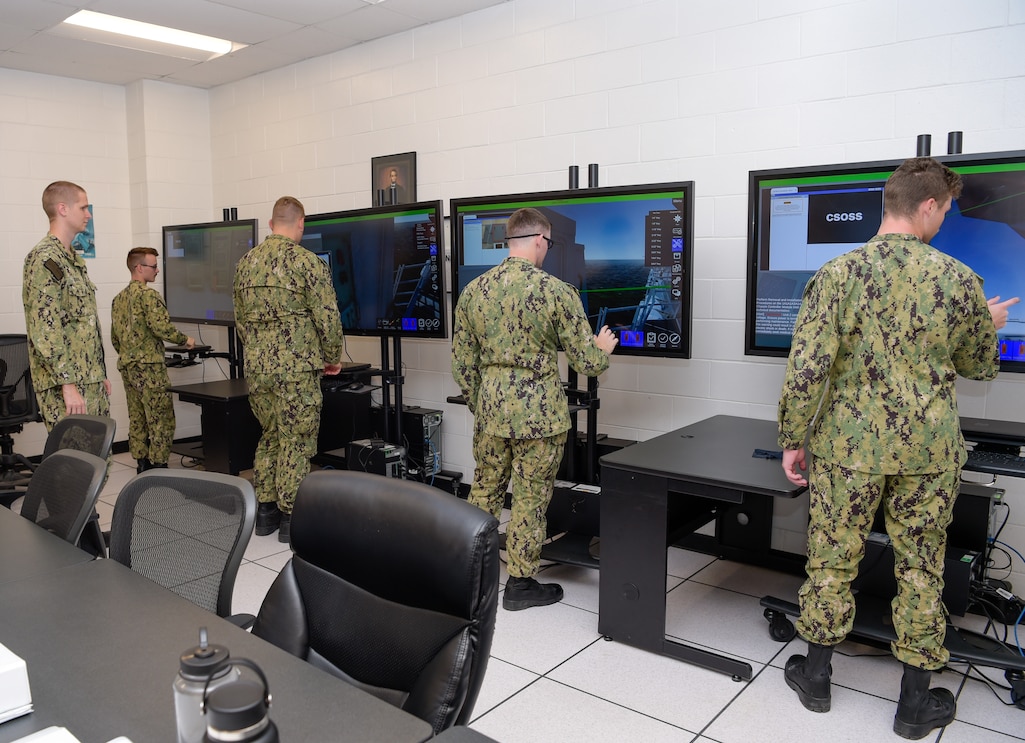 U.S. Navy Cryptologic Technician Technical (CTT) students learn about maintaining the AN/SLQ-32(V)6 shipboard electronic warfare suite using the interactive Multipurpose Reconfigurable Training System 3 Dimensional (MRTS 3D®) technology during a CTT “A” School class at Information Warfare Training Command Corry Station.