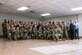 Attendees of the breakfast pose for a group photo.