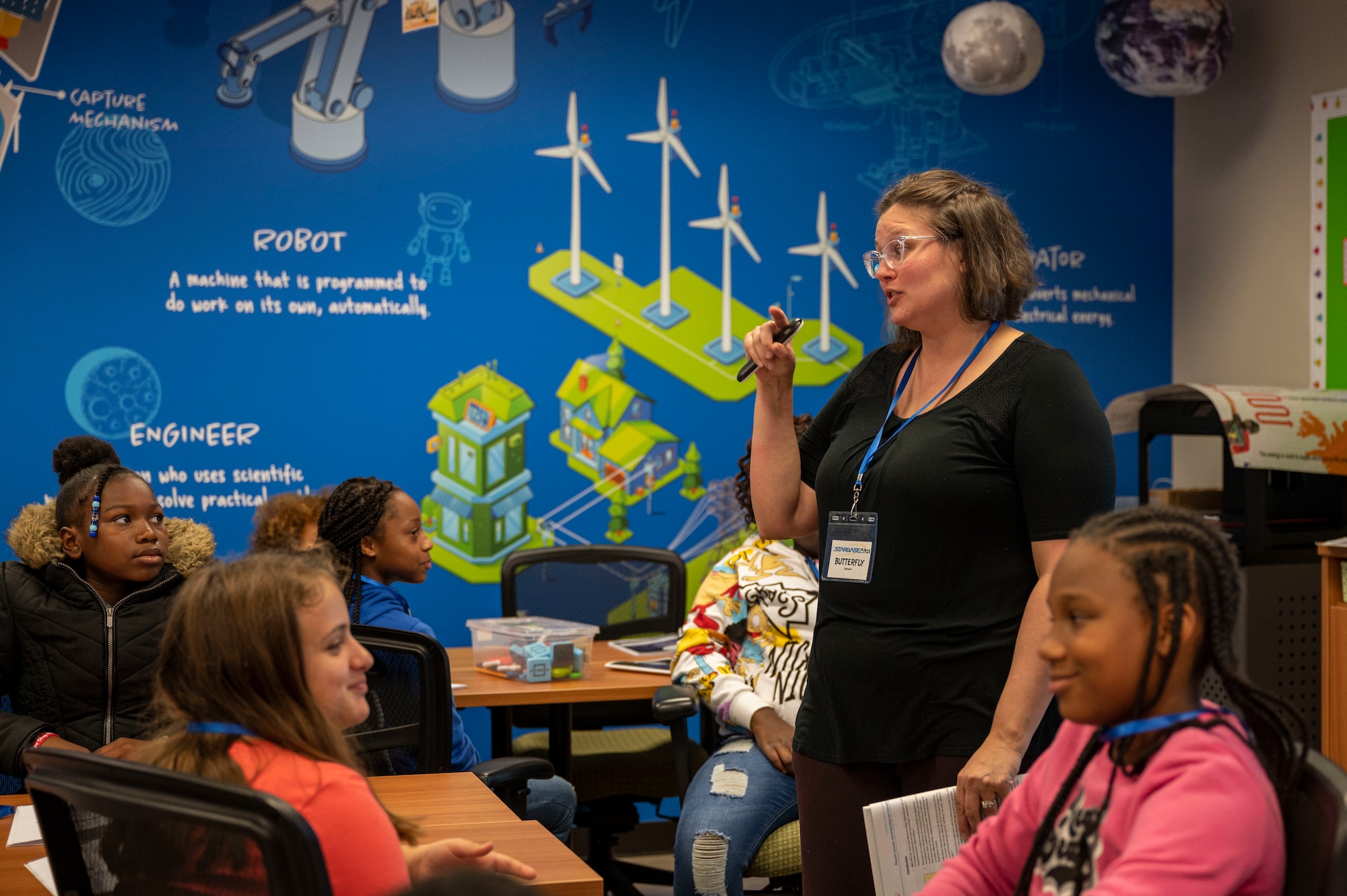 An instructor engages with her students during a class