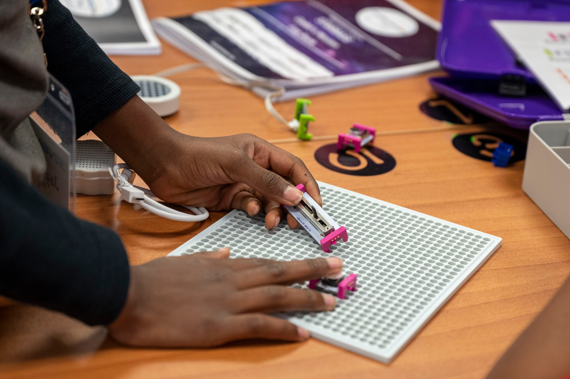 A student experiments with an electronic building kit