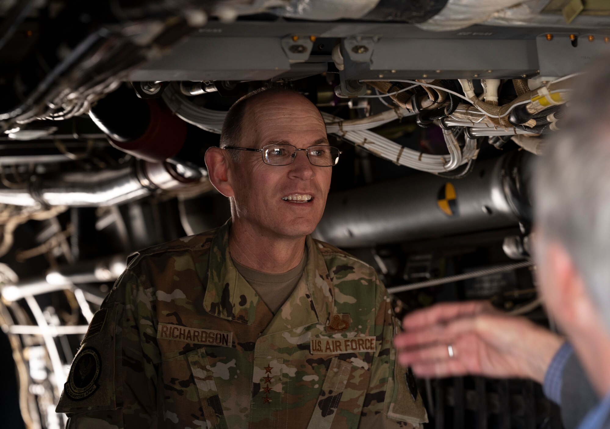 A man stands in an aircraft.