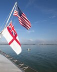 The first-in-class aircraft carrier USS Gerald R. Ford (CVN 78) flies the U.S. national and Royal British Navy ensigns while anchored in Portsmouth, England, during the ship’s second international port visit, Nov. 14, 2022. The Gerald R. Ford Strike Group is conducting their first deployment in the U.S. Naval Forces Europe area of operations. (U.S. Navy photo by Mass Communication Specialist 2nd Class Zack Guth)