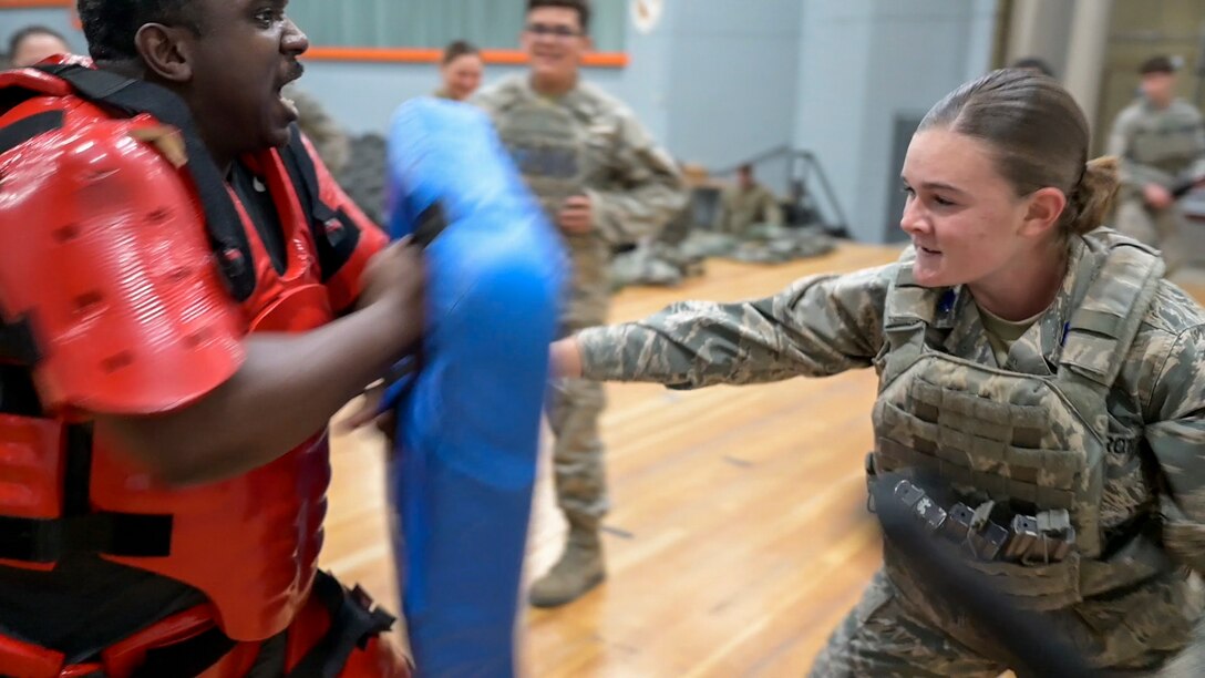 Cadet Eden Hewes battles TSgt. Quentin Humphries during defense training. About 100 JROTC cadets from Desert High School that came to learn the way of the Defender from the 412th Security Forces Squadron at Edwards Air Force Base, California.