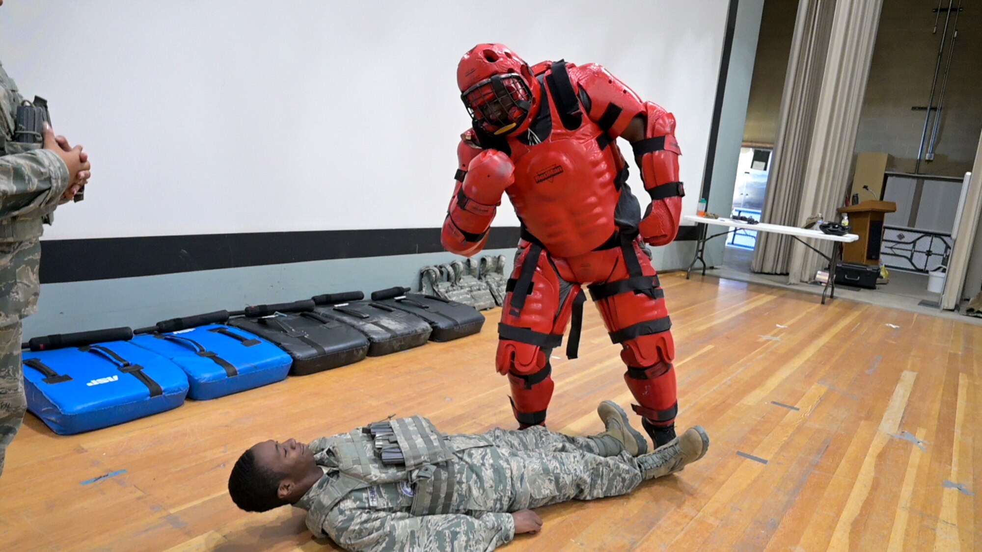 TSgt. Quentin Humphries looks over a JROTC cadet during defense training. About 100 JROTC cadets from Desert High School came to learn the way of the Defender from the 412th Security Forces Squadron at Edwards Air Force Base, California.