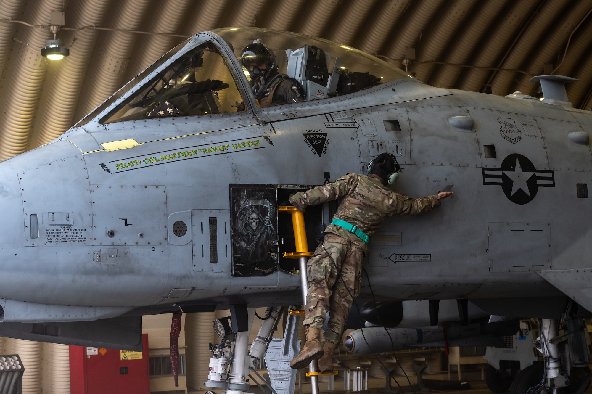 U.S. Air Force Capt. Jacob Bouck, 25th Fighter Squadron pilot, and USAF Staff Sgt. John-Michael Salenga, 25th Fighter Generation Squadron crew chief, perform preflight procedures on an A-10C Thunderbolt II before participating in an agile combat employment (ACE) training sortie
