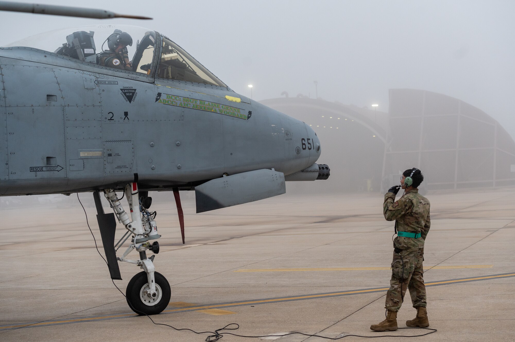 U.S. Air Force Capt. Jacob Bouck, 25th Fighter Squadron pilot, communicates from an A-10C Thunderbolt II with USAF Staff Sgt. John-Michael Salenga, 25th Fighter Generation Squadron crew chief, during preflight checks before takeoff in support of an agile combat employment (ACE) training sortie