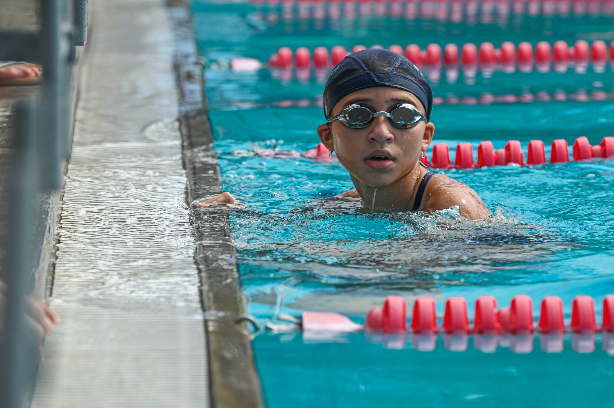 A swimmer places first in her heat.