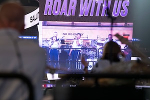 Large LED display showing band performing.
