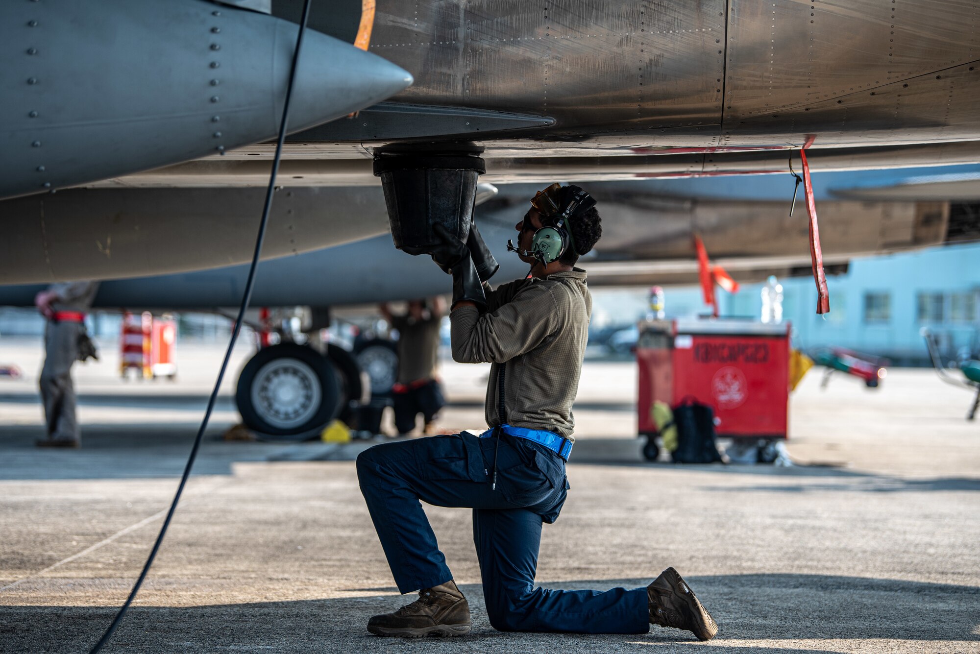 Maintainer checks jet after flight.