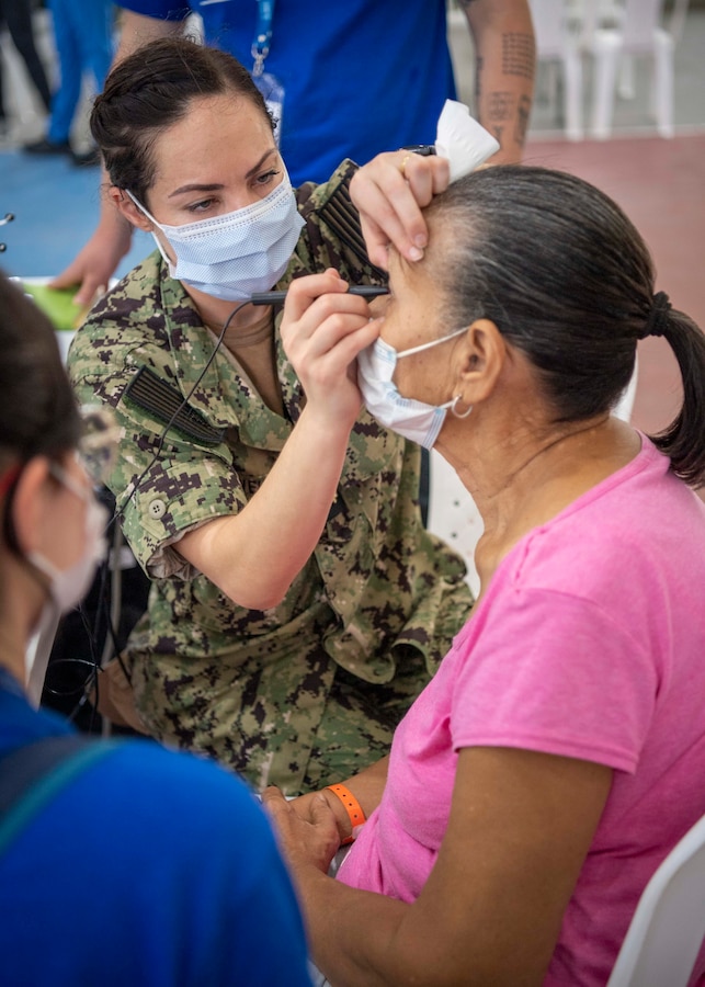 CARTAGENA, Colombia (Nov. 12, 2022) Lt. Cmdr. Brittany Powell, from Fort Belvoir, Virginia, assigned to hospital ship USNS Comfort (T-AH 20) for Continuing Promise 2022, conducts pre-operation screenings for possible eye surgery at a medical site set up in the Sports Coliseum of Combat and Gymnastics, in Cartagena, Columbia, Nov. 12, 2022.