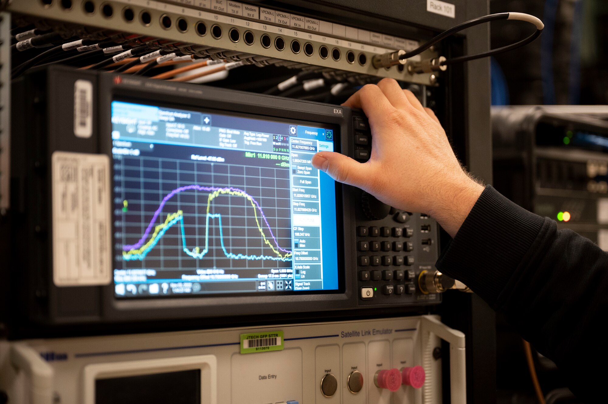 Aaron Taylor, 25th Space Range Squadron VSAT technician, operates a spectrum analyzer during a CRIMSON SKIES exercise