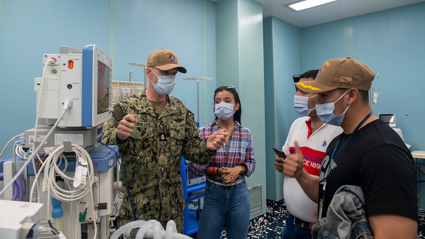 221031-N-DF135-1023 PUERTO BARRIOS, Guatemala (Oct. 31, 2022) – Chief Hospital Corpsman Shawn Burnette, from Pittsburgh, Pennsylvania, shows systems used to monitor people on anesthesia, used to perform endoscopies, to members from the Japan-Guatemala Friendship Hospital aboard to the hospital ship USNS Comfort (T-AH 20), Oct. 31, 2022. Comfort is deployed to U.S. 4th Fleet in support of Continuing Promise 2022, a humanitarian assistance and goodwill mission conducting direct medical care, expeditionary veterinary care, and subject matter expert exchanges with five partner nations in the Caribbean, Central and South America. (U.S. Navy photo by Mass Communication Specialist Seaman Deven Fernandez)