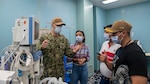 221031-N-DF135-1023 PUERTO BARRIOS, Guatemala (Oct. 31, 2022) – Chief Hospital Corpsman Shawn Burnette, from Pittsburgh, Pennsylvania, shows systems used to monitor people on anesthesia, used to perform endoscopies, to members from the Japan-Guatemala Friendship Hospital aboard to the hospital ship USNS Comfort (T-AH 20), Oct. 31, 2022. Comfort is deployed to U.S. 4th Fleet in support of Continuing Promise 2022, a humanitarian assistance and goodwill mission conducting direct medical care, expeditionary veterinary care, and subject matter expert exchanges with five partner nations in the Caribbean, Central and South America. (U.S. Navy photo by Mass Communication Specialist Seaman Deven Fernandez)