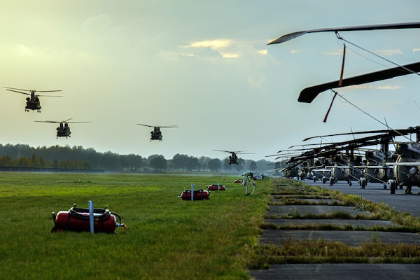 Four Army CH-47F Chinook helicopters from 1st Battalion, 214th Aviation Regiment (General Support Aviation Battalion), 12th Combat Aviation Brigade, prepare to land during exercise Falcon Autumn 22 at Vredepeel, Netherlands, November 4, 2022 (U.S. Army/Thomas Mort)