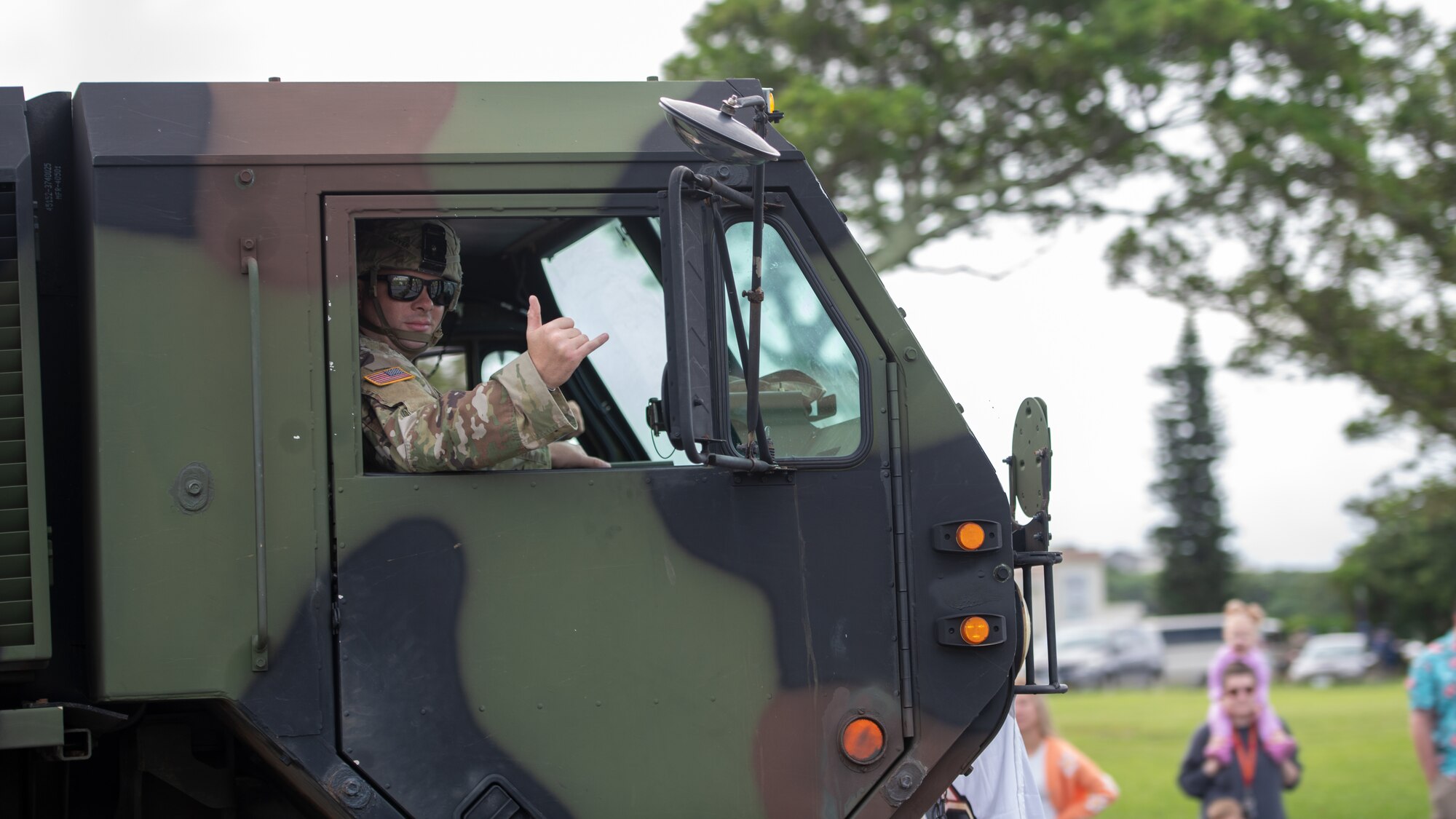 U.S. Soldier waves at camera