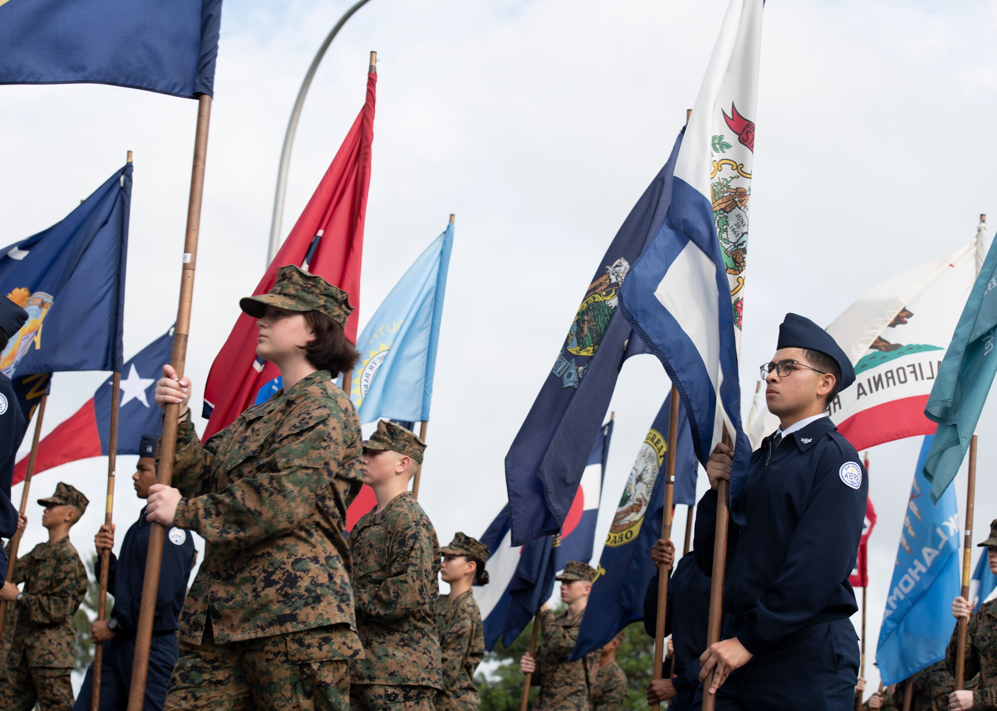 Participants march in the 8th Annual Veterans Day Parade
