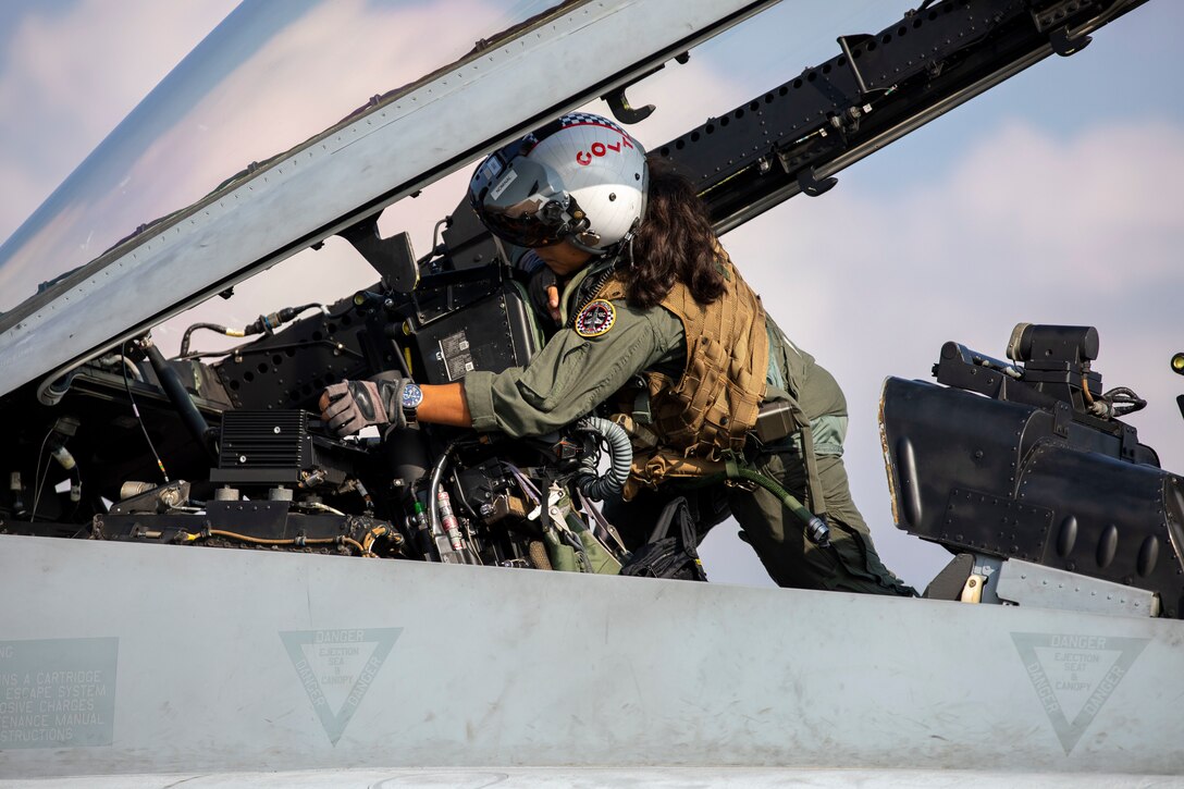 U.S. Marine Corps Capt. Heather Hamilton, a weapons systems officer with Marine Fighter Attack Squadron 312, prepares an F/A-18D Hornet aircraft cockpit for flight during exercise Keen Sword 2023 at Japan Air Self-Defense Force Nyutabaru Air Base, Japan, Nov. 11, 2022. Keen Sword is a biennial exercise designed to enhance Japan-U.S. readiness, interoperability, and bilateral relations while demonstrating U.S. resolve to support the security interests of allies and partners in the Indo-Pacific region. (U.S. Marine Corps photo by Sgt. Jackson Ricker)