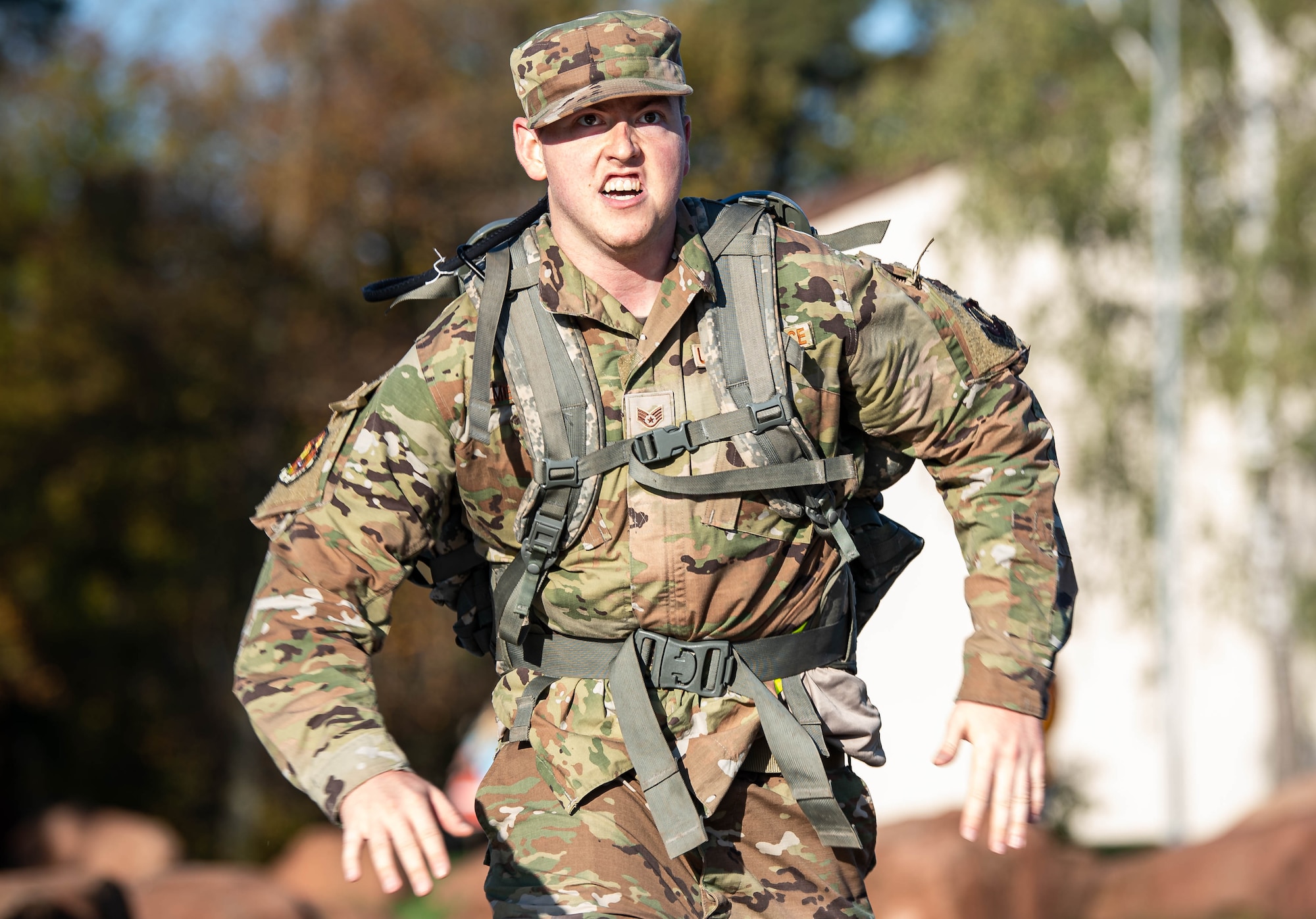 U.S. Air Force Staff Sgt. Cordell Merten, 603rd Air Operations Center noncommissioned officer in charge of the imagery support element, sprints toward the finish line during the Norwegian Foot March at Ramstein Air Base, Germany, Nov. 5, 2022. Traditionally, the event simulated overnight movement by a dismounted light infantry element with the objective to seize attack positions. The element would occupy the positions prior to day break and continuously fight until they consolidated its gains later that evening. (U.S. Air Force photo by Airman 1st Class Jared Lovett)