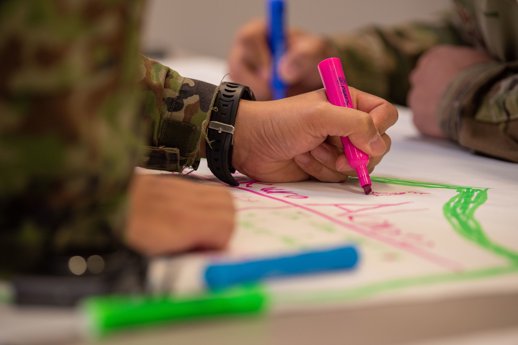 A Japan Ground Self-Defense Force soldier writes for an icebreaker event during Camp Sendai’s Basic English Training Course tour of the Airman Leadership School at Misawa Air Base, Japan, Nov. 8, 2022.
