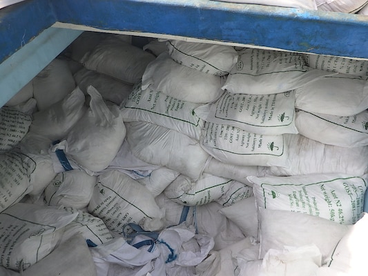 GULF OF OMAN (Nov. 8, 2022) A large quantity of urea fertilizer and ammonium perchlorate sit in a cargo compartment on board a fishing vessel intercepted by U.S. naval forces while transiting international waters in the Gulf of Oman, Nov. 8.