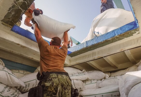 GULF OF OMAN (Nov. 9, 2022) Sailors from guided-missile destroyer USS The Sullivans (DDG 68) inventory a large quantity of urea fertilizer and ammonium perchlorate discovered on a fishing vessel intercepted by U.S. naval forces while transiting international waters in the Gulf of Oman, Nov. 9.