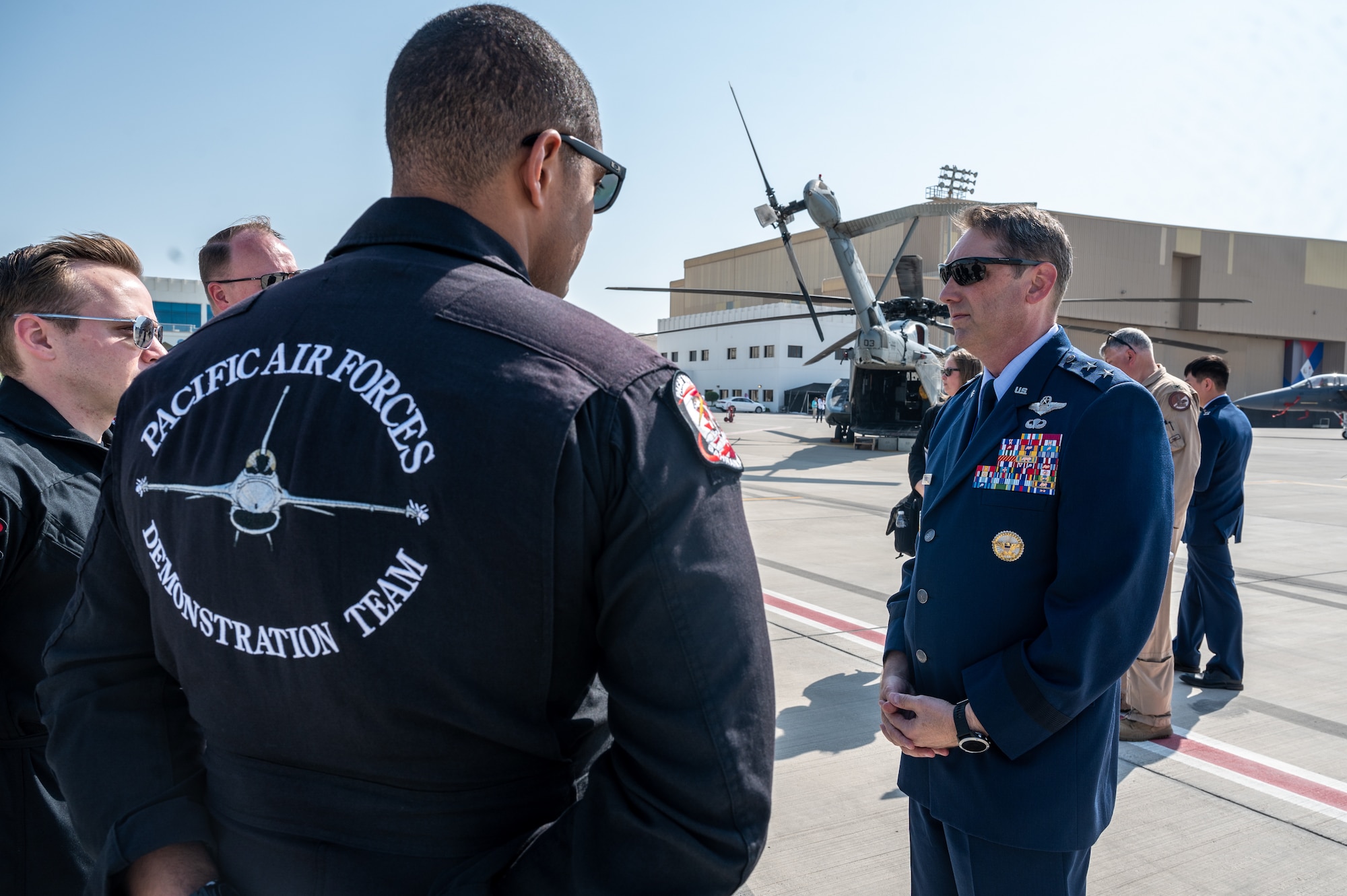 U.S. Air Force Maj. Gen. David Harris, Deputy Commander, Ninth Air Force (Air Forces Central), visits with the Pacific Air Forces’ F-16 demonstration team during the Bahrain International Airshow (BIAS), at Sakhir Airbase, Bahrain Nov. 9, 2022. The airshow is a biennial, three-day aviation and aerospace industry event that provides the opportunity to showcase the interoperability of U.S. and partner nation aircraft. (U.S. Air Force photo by Staff Sgt. Jermaine Ayers)