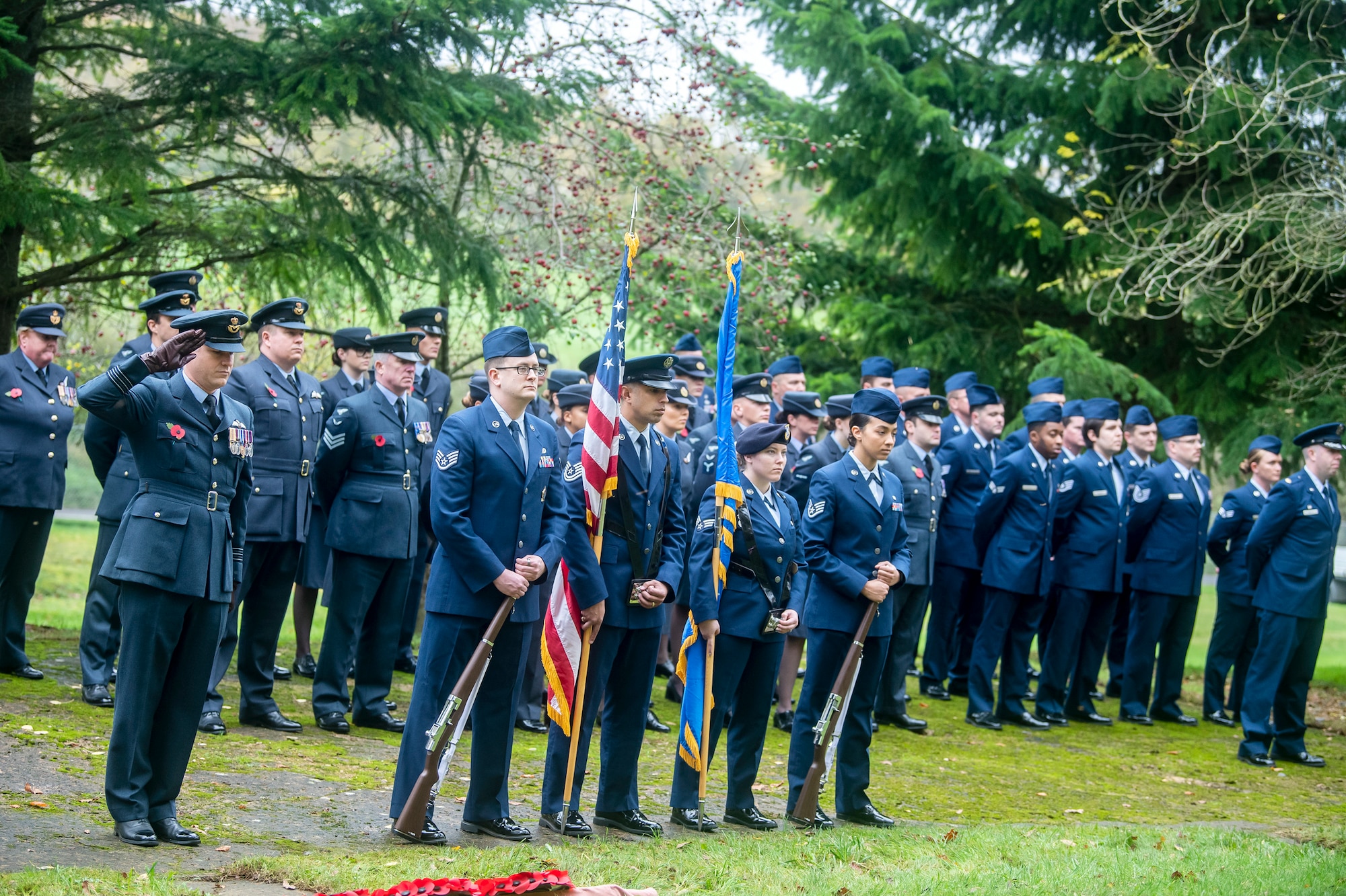 U.S. and U.K. Airmen stand in formation during a Remembrance Day ceremony at RAF Welford, England, Nov. 10, 2022. Airmen from the 501st Combat Support Wing, Royal Air Force, and distinguished guests came together to honor the sacrifices of armed forces veterans, past and present. (U.S. Air Force photo by Staff Sgt. Eugene Oliver)