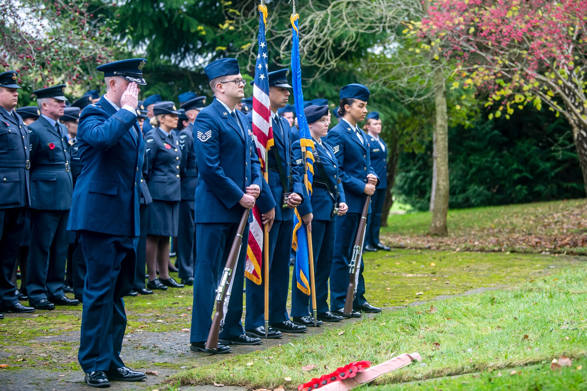 U.S. Air Force Maj. Preston Smith, left, 420th Munitions Squadron commander, salutes during a Remembrance Day ceremony at RAF Welford, England, Nov. 10, 2022. Airmen from the 501st Combat Support Wing, Royal Air Force, and distinguished guests came together to honor the sacrifices of armed forces veterans, past and present. (U.S. Air Force photo by Staff Sgt. Eugene Oliver)