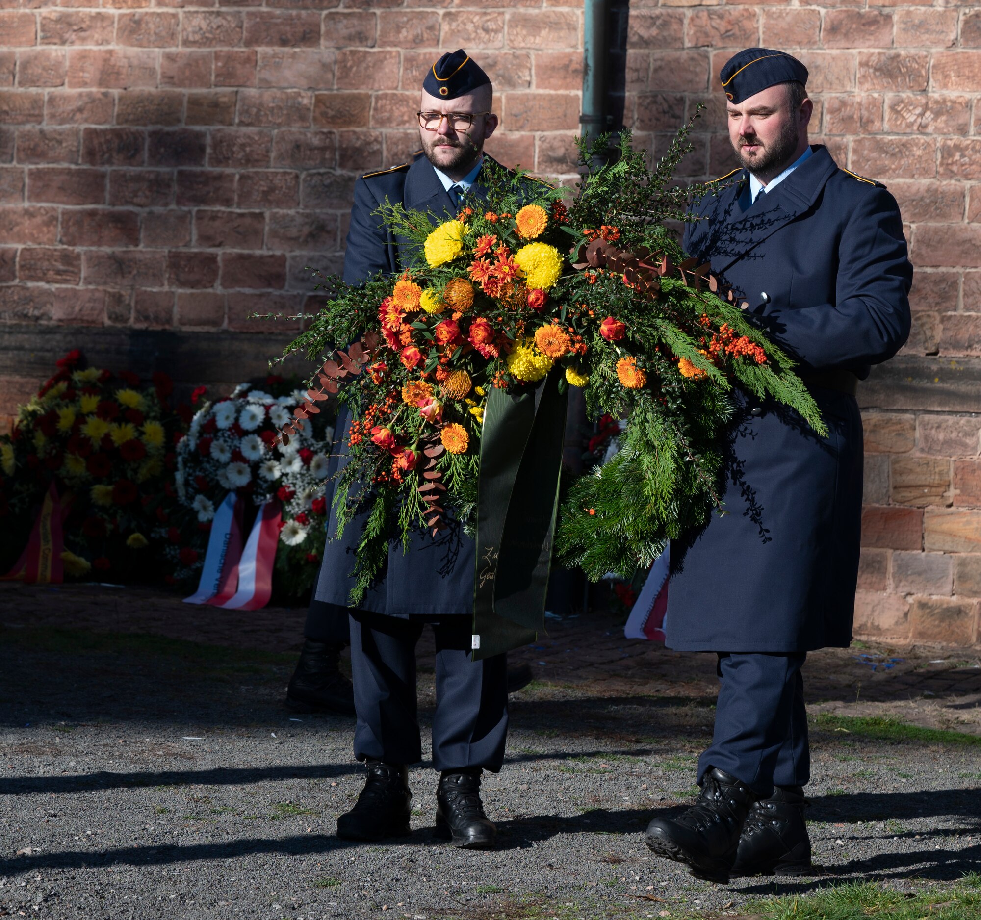 Members of the German Luftwaffe carry a wreath at the National Day of Mourning ceremony in the Union Community of Ramstein-Miesenbach, Germany, Nov. 13, 2022. Twenty one nations from NATO attended the National Day of Mourning Ceremony to commemorate all those who lost their lives in war and violent oppression, and show signs of friendship and healing. (U.S. Air Force photo by Senior Airman Thomas Karol)
