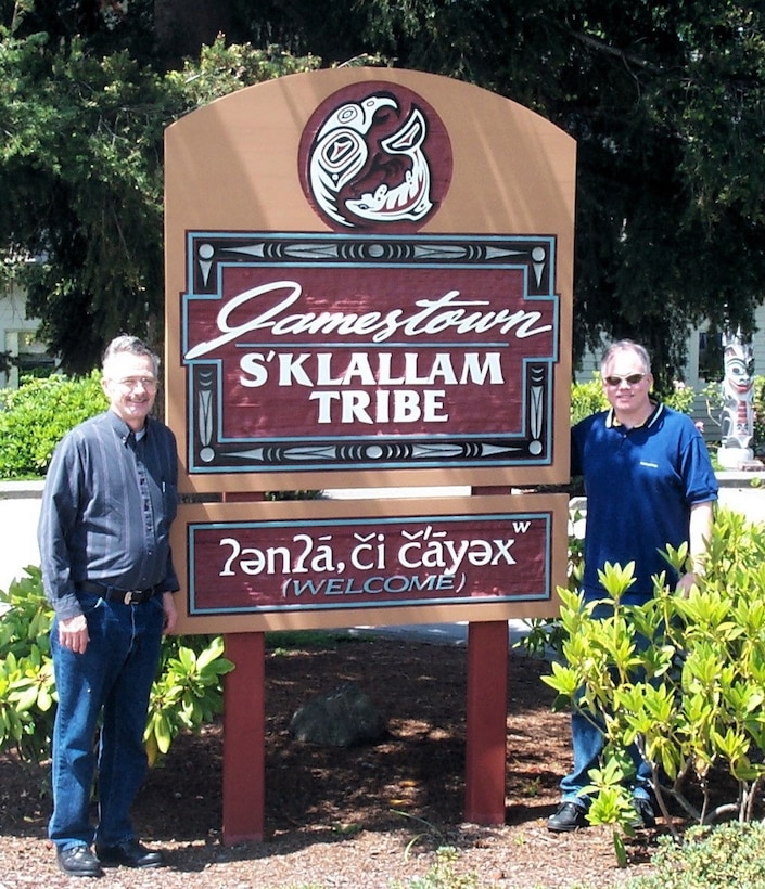 Vanoy Welch and his uncle in front of tribal sign during
their visit to tribal headquarters.