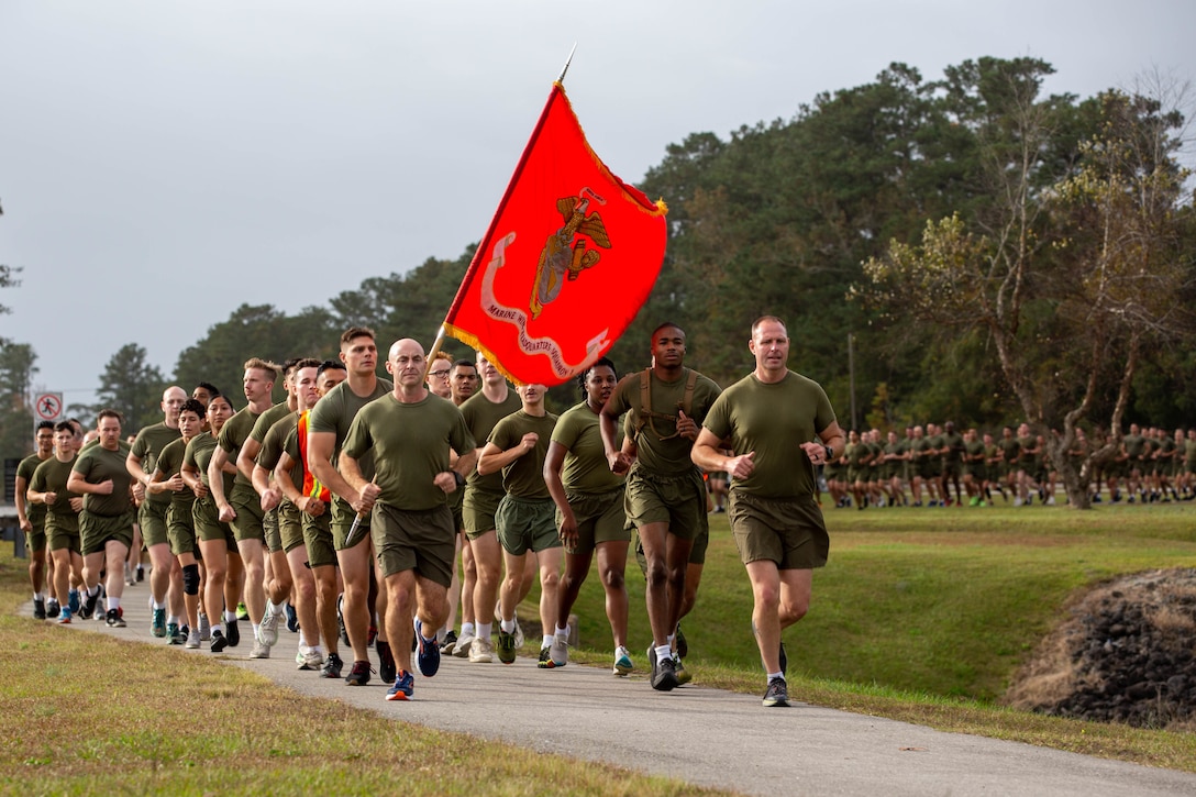 U.S. Marines with 2nd Marine Aircraft Wing (MAW) run in formation at Marine Corps Air Station Cherry Point, North Carolina, Nov. 10, 2022. Marines with 2nd MAW ran to celebrate the 247th birthday of the Marine Corps. 2nd MAW is the aviation combat element of II Marine Expeditionary Force. (U. S. Marine Corps photo by Sgt. Servante R. Coba)
